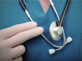 Stethoscope on the doctors workwear macro