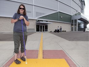 The bright yellow tactile markers at all entrances of Mosaic Stadium make it easy for Michelle Busch to enter the venue.