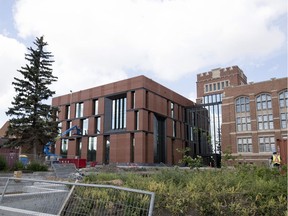 An exterior rear view of the nearly completed College Building restoration, which includes a new structure (on the left) and the 1912 building (on the right).