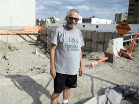 Ernie Meid, a local man who has put a downpayment on a unit at Capital Pointe, stands near the big hole on the corner of Victoria Avenue and Albert Street in Regina.