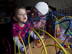 Alex Repetski, right, plays with his two-year-old daughter Gwenevere in Toronto. Gwenevere's epileptic seizures are being treated with cannabidiol.
