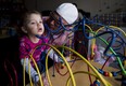 Alex Repetski, right, plays with his two-year-old daughter Gwenevere in Toronto. Gwenevere's epileptic seizures are being treated with cannabidiol.