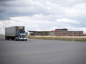 A semi tractor trailer unit leaves the Canadian Pacific Intermodal Facility at the  Global Transportation Hub just west of Regina.