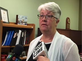 Cathy Sproule speaks to reporters about the 2017-2018 GTH annual report in her constituency office on July 30, 2018.