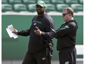 Offensive co-ordinator Stephen McAdoo (left) will be back with Riders head coach and general Chris Jones (right) for another CFL season.