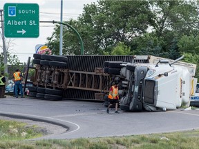 A semi truck tipped over on the on ramp at the intersection of Albert Street and Ring Road.
