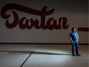 Michael Lavis, a member of the board of directors for the Tartan Curling Club, stands on the ice surface at the Tartan Curling Club on Broadway Avenue.
