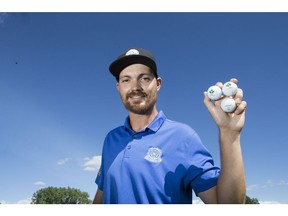 Saskatoon Golf and Country Club member Taylor Afseth holds the three golf balls he used to ace three different hole-in-ones at multiple courses over 12 consecutive days.