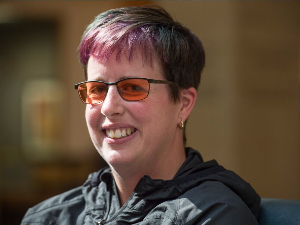 Paralympian doing coin drop at Rider's diversity game Regina Leader Post