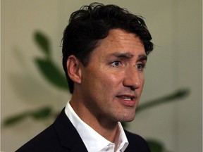 Prime Minister Justin Trudeau speaks to media as he arrives at the Vancouver Island Conference Centre during day two of the Liberal cabinet retreat in Nanaimo, B.C., on Wednesday, August 22, 2018.