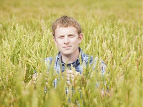 Researcher Kirby Nilsen in a wheat field.