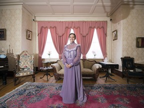 Courtney Harlos, employee of Government House, stands in the Amédée Forget Museum at Government House in Regina.