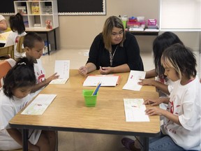 Bobby Jo Wesley guides Grade 1 and 2 students through a book during the United Way literacy camp at Albert School in Regina.