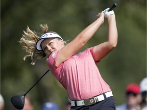 Brooke Henderson tees off as fans look on during Round 1 of the CP Women's Open at the Wascana Country Club in Regina.