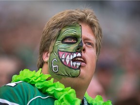 A Saskatchewan Roughriders fan cheers during a game against the Calgary Stampeders at Mosaic Stadium.