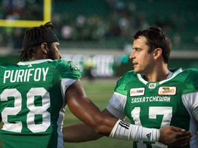 Saskatchewan Roughriders quarterback Zach Collaros (17) celebrates with teammate Loucheiz Purifoy (28) following a win against the Calgary Stampeders at Mosaic Stadium.