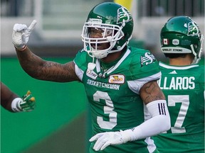 The Saskatchewan Roughriders' Nick Marshall, 3, celebrates a 67-yard interception return for a touchdown during Sunday's 40-27 victory over the visiting Calgary Stampeders.