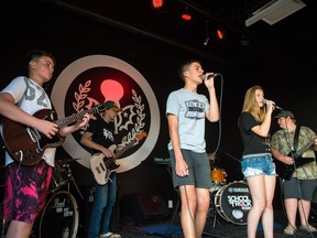 School of Rock Regina students (from left) Jaxon Hicks, Harrison Mooney, Brennan Koshykowski, Jade Russell, Marshall Brooks (on drums) and Cohen Jones rehearse in advance of Saturday's Modern Rock show.