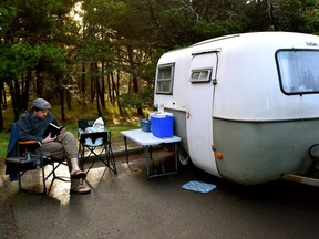 Shawn Fraser catches up on reading outside his 1972 Boler on the family of five's epic four-month 17,000-kilometre road trip
Photo courtesy of Nichole Huck