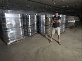 Jeremy Reed, co-owner of The Stables brewery, stands among kegs and tanks in the old Weston Bakery building.