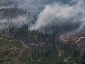 The Shovel Lake wildfire burns near the Nadleh Whut'en First Nation in Fort Fraser, B.C., on Thursday August 23, 2018. British Columbia has extended its state of emergency because of wildfires burning across the province to the end of the day on Sept. 12.