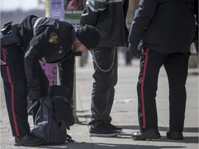 The Saskatchewan Police Commission released a policy this summer stating that police cannot randomly stop people on the street and ask for information. The policy further specifies that street checks cannot be performed based solely on a person’s race. If Saskatoon police officers insist on performing street checks, they must start keeping track of the ethnicity of the people they stop, says a University of Saskatchewan law professor who has been consulting with community members about street checks. (illustration) (Saskatoon StarPhoenix/Liam Richards)