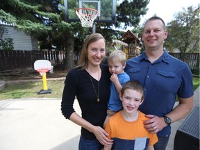 Katarina and Shaun Nechvatal stand with their two sons Benjamin (youngest) and Dominic, who have both been diagnosed with cystic fibrosis.