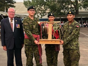 Private D. Carrier-Henry (centre) from the Taypotat Platoon, Private B. Daniels from the Wolfe Platoon and Private D. Regnier accepting the Second Place Candidate Award on graduation day.