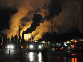 Workers leave the Suncor oil sands extraction facility near the town of Fort McMurray in Alberta on October 22, 2009.