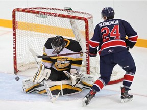 Koby Morrisseau of the Regina Pats tries to get the puck past Brandon Wheat Kings netminder Ethan Kruger on Friday at Westoba Place.