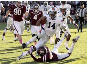 Nick Marshall of the Auburn Tigers rushes for a touchdown against the Texas A&M Aggies on Oct. 19, 2013. Marshall, now of the Saskatchewan Roughriders, ran for two touchdowns and threw for two more scores to lead Auburn to a 45-41 victory.