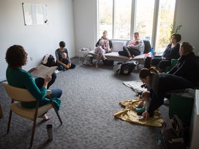 Kayla Huszar, left, conducts her Mindful Mothering group in the Red Fox Creative Studios on Angus Street.