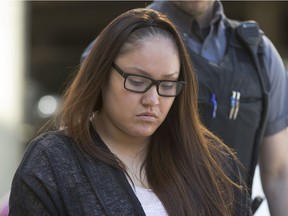 Cheyann Peeteetuce entering Queen's Bench Court in custody for sentencing arguments on May 13, 2015