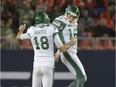 Holder Josh Bartel, 18, celebrates with Brett Lauther on Saturday after the Saskatchewan Roughriders kicker nailed what proved to be a game-winning, 56-yard field goal against the Toronto Argonauts.