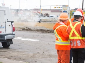 Safety crews work at a scene where gas was leaking from a spot on the ground near a construction site along Victoria Avenue on the east side of the city. BRANDON HARDER/ Regina Leader-Post
