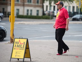 Regina Leader-Post sports editor Rob Vanstone is captured in a still picture — the speed he was actually moving — during Thursday's Walk A Mile In Her Shoes event.