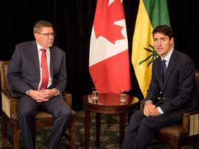 Prime Minister Justin Trudeau (right) meets with Saskatchewan Premier Scott Moe in Saskatoon, Sask., Wednesday, September 12, 2018.