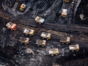 Heavy haulers are seen at the Suncor Energy Inc. Fort Hills mine in this aerial photograph taken above the Athabasca oil sands near Fort McMurray, Alberta.