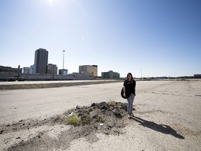 Warehouse District executive director Leasa Gibbons stands in the former CP rail yard lot in Regina.