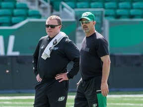 Craig Dickenson, right, shown alongside head coach Chris Jones at a practice, is in charge of one of the CFL's top special-teams units.