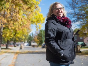 Jordana Buchan, a woman who lives with stage 4 cancer, stands on the street near her home. She is the co-captain of the Run For the Cure team Count Me(ts) that is comprised of 94 members and has raised over $64,000 for to go to metastatic breast cancer research.