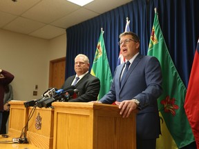 Premier Doug Ford of Ontario (left) and Premier Scott Moe of Saskatchewan (right) announce Saskatchewan's decision to file for intervener status in Ontario's court challenge regarding the federal carbon tax at a press conference in the Saskatoon cabinet office on Oct. 4, 2018.