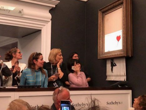 Onlookers at the auction watched as one of Banksy's most iconic images was spontaneously shredded right before their eyes.