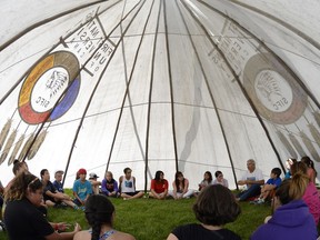 Joseph Naytowhow (right) has received the 2018 Saskatchewan Arts Award for Arts and Learning.