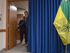 Premier of Saskatchewan Scott Moe, right, opens the door with Premier of Ontario Doug Ford prior to a media event in Saskatoon, Thursday, October 4, 2018. The federal government argues it has jurisdiction to impose a carbon tax as it's a matter of national concern in a factum filed in Saskatchewan's Court of Appeal.