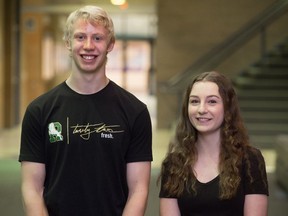 Jaxon Fuchs and Sarah Morhart, Grade 12 students at Michael A. Riffel High School, stand in the school. The students were among those who helped to gather a large food donation for the Regina Food Bank.