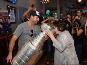Washington Capitals professional scout Jason Fitzimmons, left, was able to share the Stanley Cup with his family and friends on Friday.