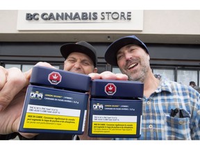 Don and Aaron (last names withheld) from the United States show off their cannabis purchases outside British Columbia's first legal B.C. cannabis store in Kamloops, B.C. Wednesday, Oct. 17, 2018. Canada legalized cannabis nation wide today.