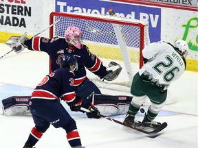 Reece Vitelli of the Everett Silvertips is robbed by the left pad of Regina Pats goalie Max Paddock during WHL action at the Brandt Centre on Sunday.