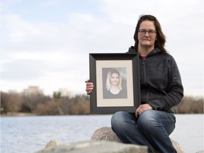 Sandra LaRose holds a photo of her late daughter Kailynn Bursic-Panchuk in Regina last October. Her daughter died at the age of 17 after her car collided with a train last summer.